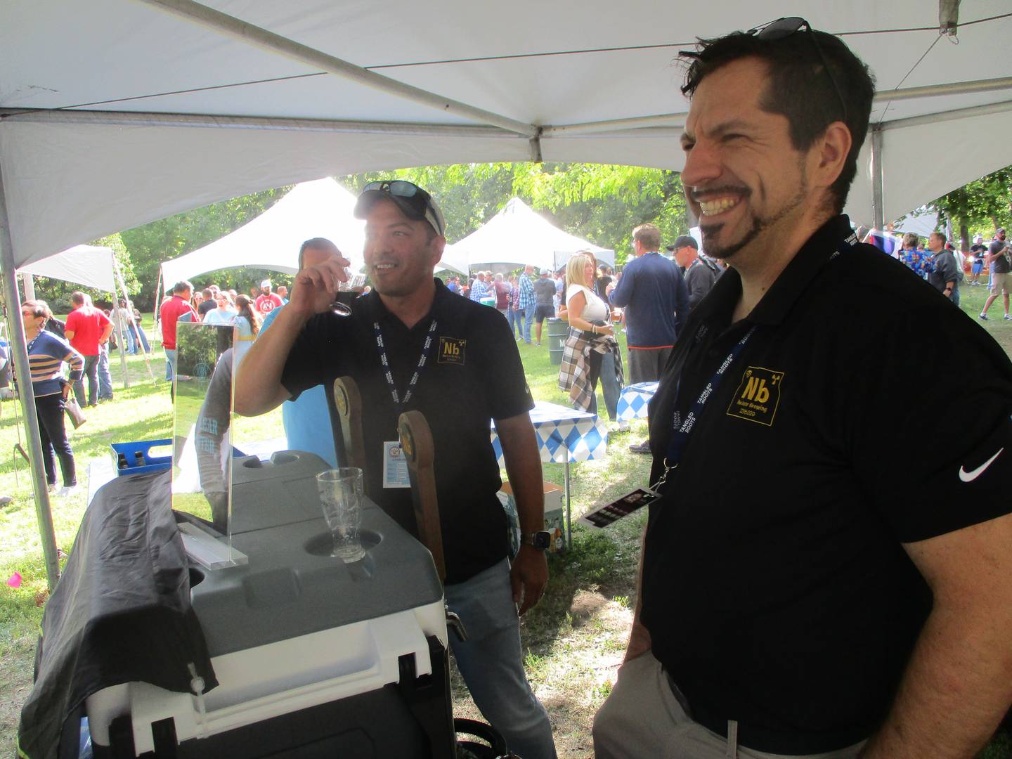 Marc McNames (left) and Matt Cosenza, co-owners of Nuclear Brewing in Morris, provide samples of their beer at the Morris Beer Festival on Saturday. Sept. 6, 2025