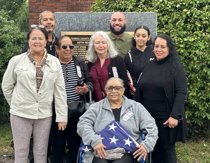 The Clarke Family poses next to the monument in honor of their family member Charles Moses Sr during a Civil War Monument Ceremony on Friday, Sept. 22, 2023 outside the Sash Stalter Matson Building in Princeton. The memorial honors 45 black troops who lived in Bureau County and fought in the Civil War.