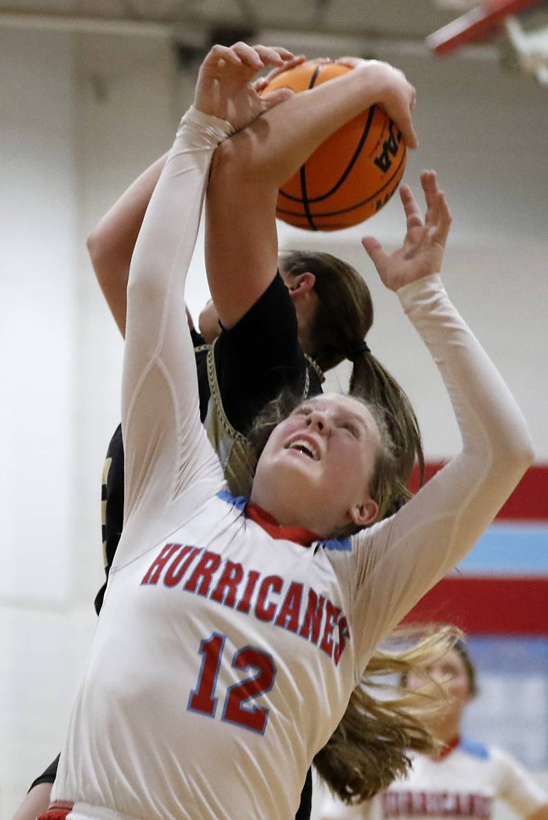 Marian Central's Abbey Miner battles with Rockford Christian's Shea Ludwig for a rebound during a nononference basketball game on Monday, Feb. 10, 2025, at Marian Central High School  in Woodstock.