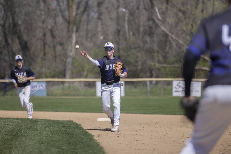 Dixon’s Quade Richards fires to first for an out against Newman Saturday, April 13, 2024 at Veterans Memorial Park in Dixon.