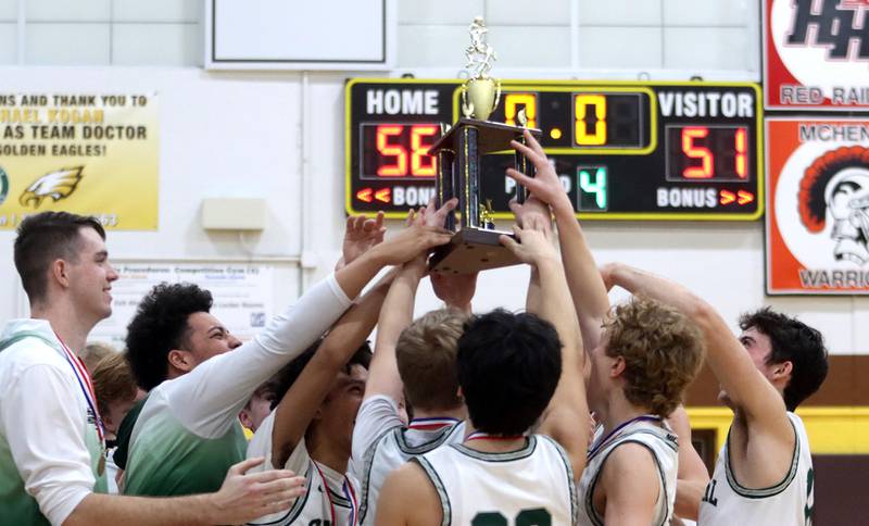 Grayslake Central’s Rams celebrate a 56-51 win over Crystal Lake South in Hinkle Holiday Classic Basketball Tournament title game action at Jacobs High School Friday.