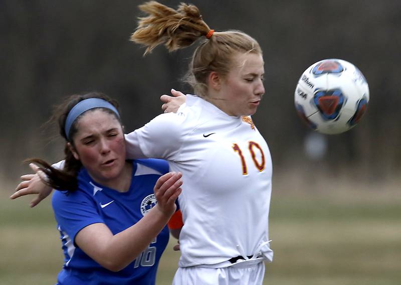 Richmond-Burton's Margaret Love, right, controls the ball in front of Woodstock's Natalie Morrow during a Kishwaukee River Conference soccer match Wednesday, April 30, 2022, between Richmond-Burton and Woodstock at Creekside Middle School.