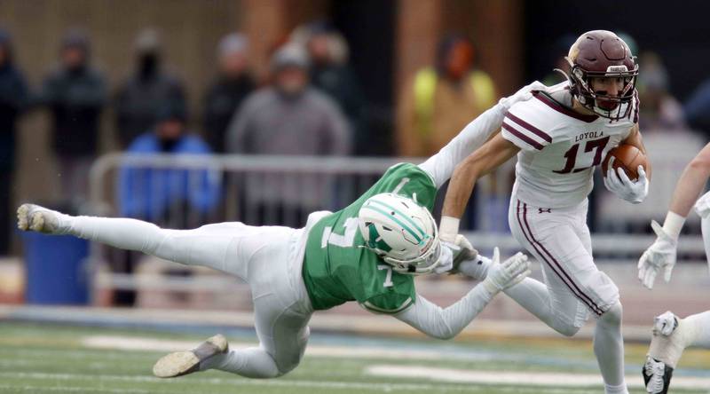 York’s Matt Sutter (7) dives after Loyola's Declan Forde (17) during the IHSA Class 8A semifinal football game Saturday November 19, 2022 in Elmhurst.
