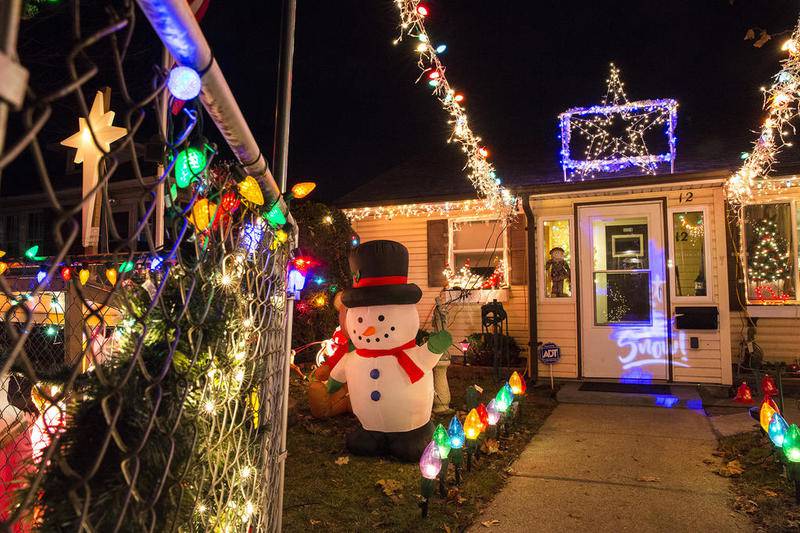 Christmas lights illuminate the night on Sunday at 12 Park Drive in Joliet. Owner Lou Schmidberger and his wife, Karen, set up lights for the past 15 years. After Karen's death Lou has maintained the tradition as a memorial.