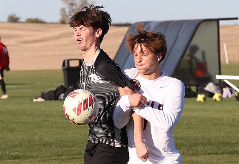 Kaneland's Cameron Guernon tries to hold off DeKalb's Ruari Bengford-Breneisen during their game Thursday, Oct. 17, 2024, at Kaneland High School in Maple Park.