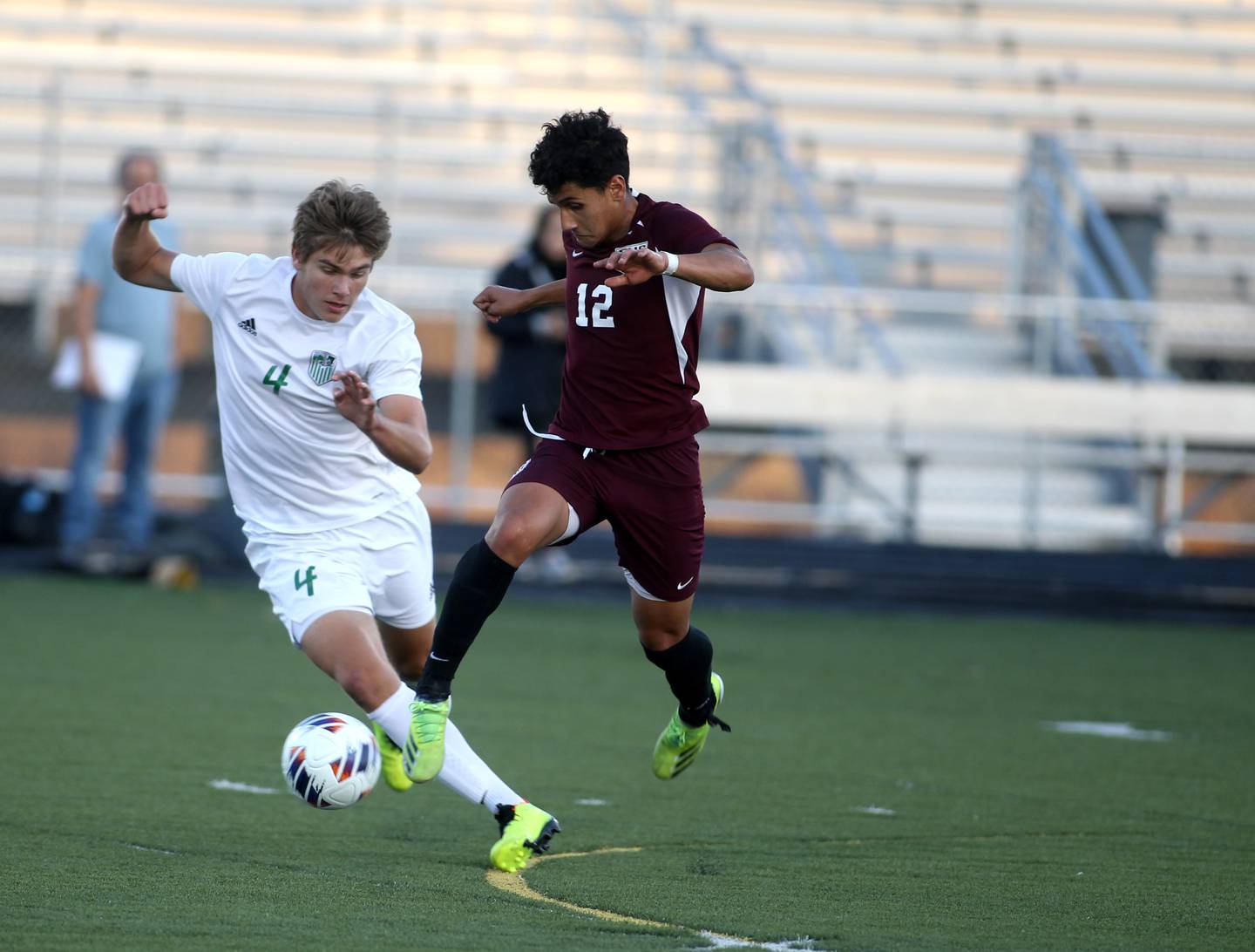 York’s William Czech (4) gets the ball away from Elgin’s Geo Catalan in the first half of the 3A Boys Soccer Supersectional at Streamwood High School on Tuesday, Nov. 1, 2022.