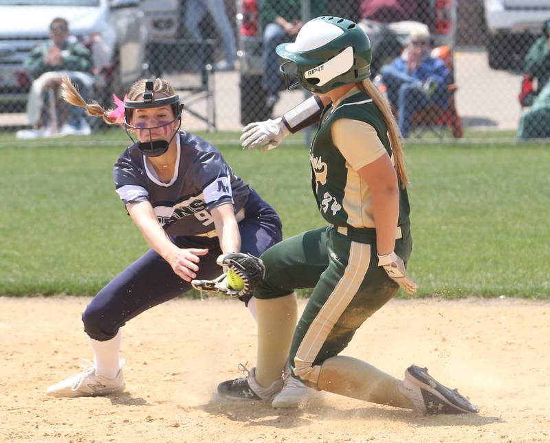 St. Bede's Tessa Dugosh slides safely into second base as Annawan/Wethersfield's Elaina Manuel misses the tag in the Class 1A Regional final game on Saturday, May 20, 2023 in Annawan.
