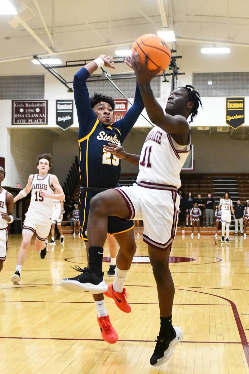 Kankakee's Jordan Davis goes for a layup against Sterling's Kaedon Phillips during the Kays' 85-50 victory over Sterling in the IHSA Class 3A Morris Regional championship on Friday, Feb. 28.