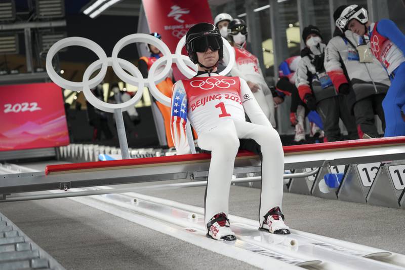 Casey Larson, of Barrington, prepares for his first jump during the men's normal hill individual ski jumping trial round at the 2022 Winter Olympics, Sunday, Feb. 6, 2022, in Zhangjiakou, China.