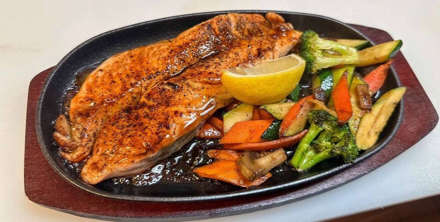 Trained as a hibachi chef, Erdene Sainnyambu recently added dishes like the teriyaki salmon hot plate to the Tatsu Ramen House menu.