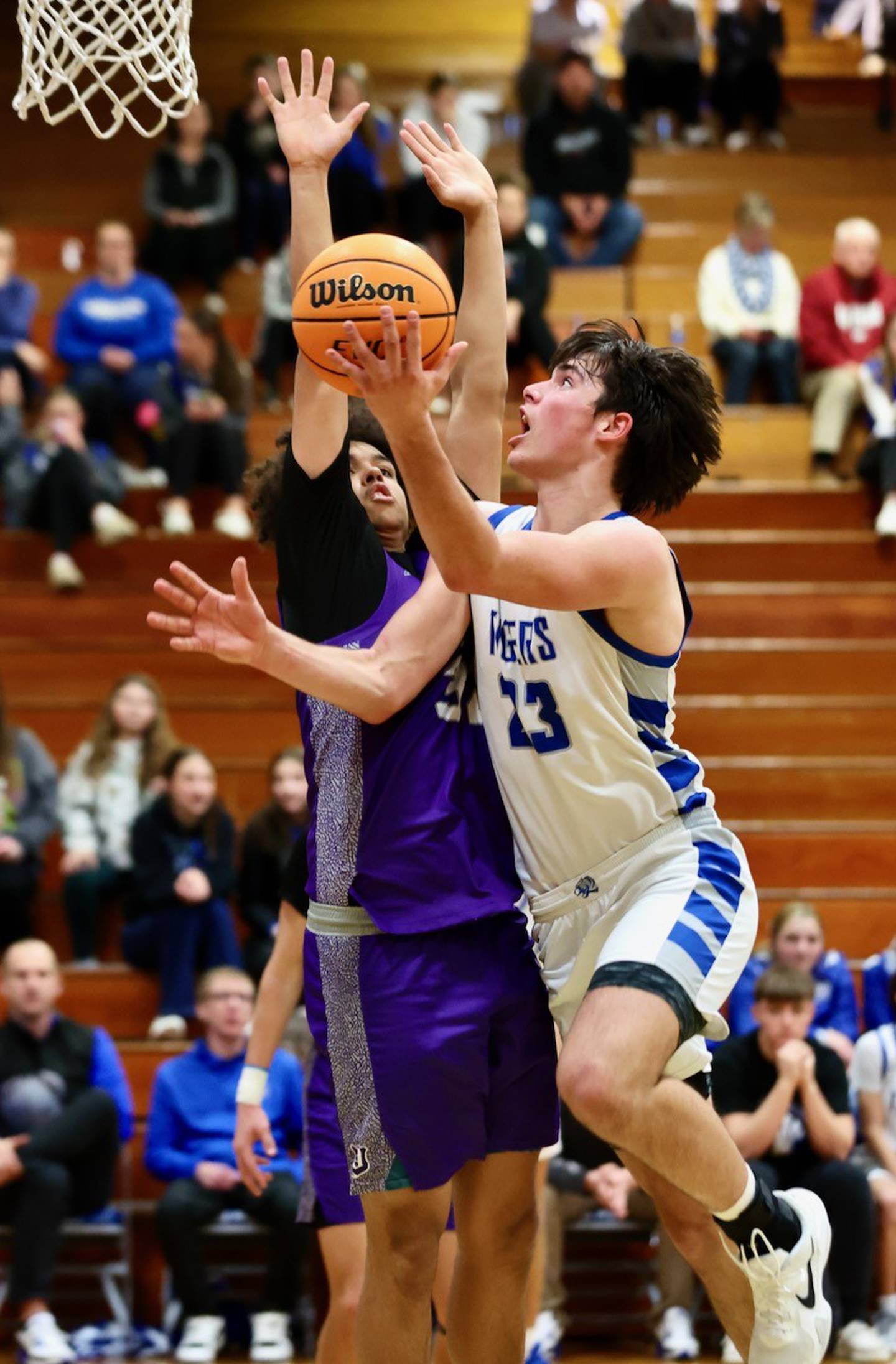 Princeton's Noah LaPorte attacks Dixon's Darius Harrington for a second-half shot  Monday night at Prouty Gym. The Dukes won 61-50.