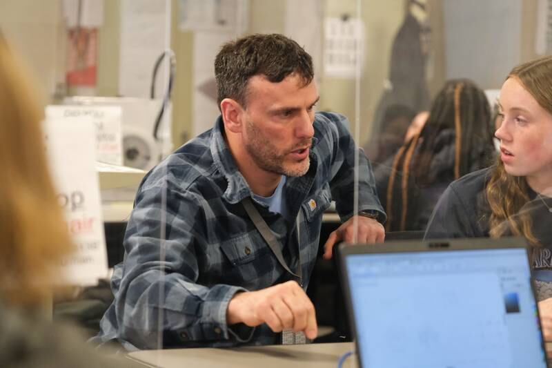 Rodger Ebert, a technology education teacher at Lockport Township High School, works with Lucy Hynes on a project. Ebert received the school's Maroon Award during the 2021-2022 school year for going “above and beyond” to help the students, according to the award description. Wednesday, April 20, 2022, in Lockport.