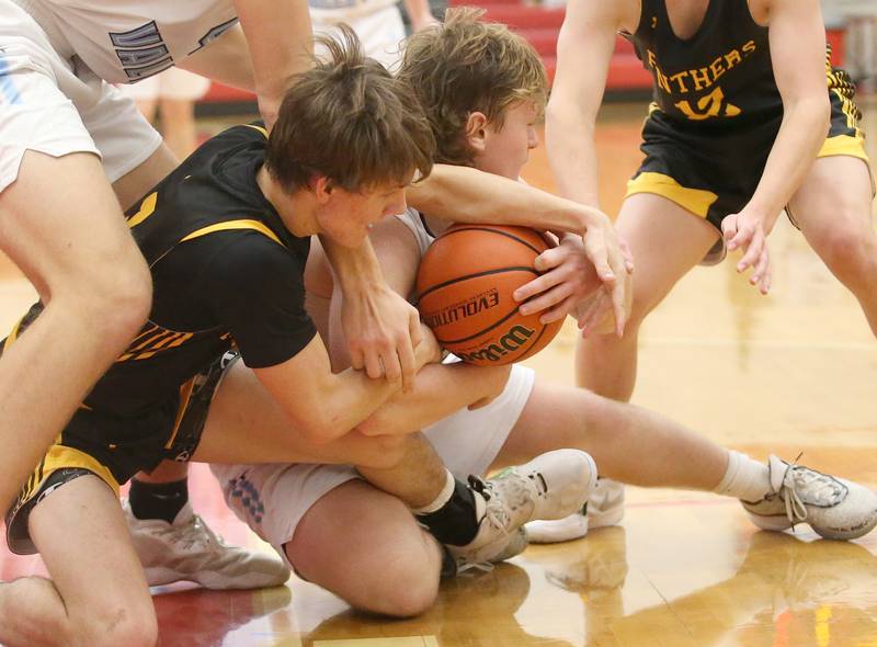 Bureau Valley's Elijah Endress holds onto the ball as Putnam County's Bryce Smith tries to knock it free during the 49th annual Colmone Class on Thursday, Dec. 7, 2023 at Hall High School.