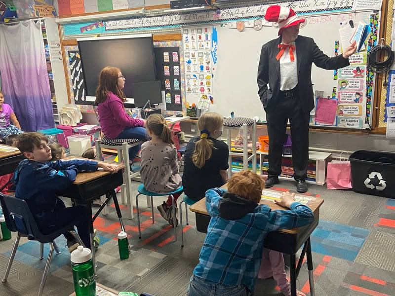 Bob Sondgeroth, Rock Falls Rotarian, reads Dr. Seuss stories to second grade students at East Coloma-Nelson School as a part of the Rock Falls Rotary volunteer reading program on Wednesday, March 2, birthday of Dr. Seuss.  Students were from the two second grade classes of Katie Merrell and Rebecca Repass.
