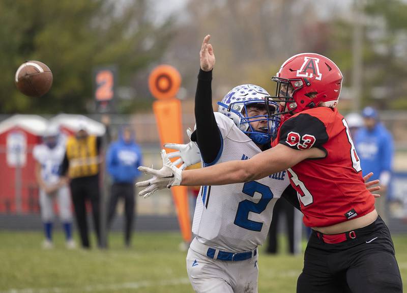 Amboy’s Caleb Yanos reaches for a pass against Martinsville’s Kaiden Simons Saturday, Nov. 9, 2024, in round two of the 8-man football playoffs. Simons was called for pass interference.