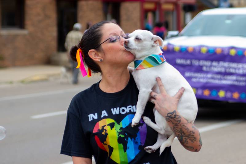 Parader kisses dog on Saturday, June 8, 2024 at Jordan Block Park in Ottawa.