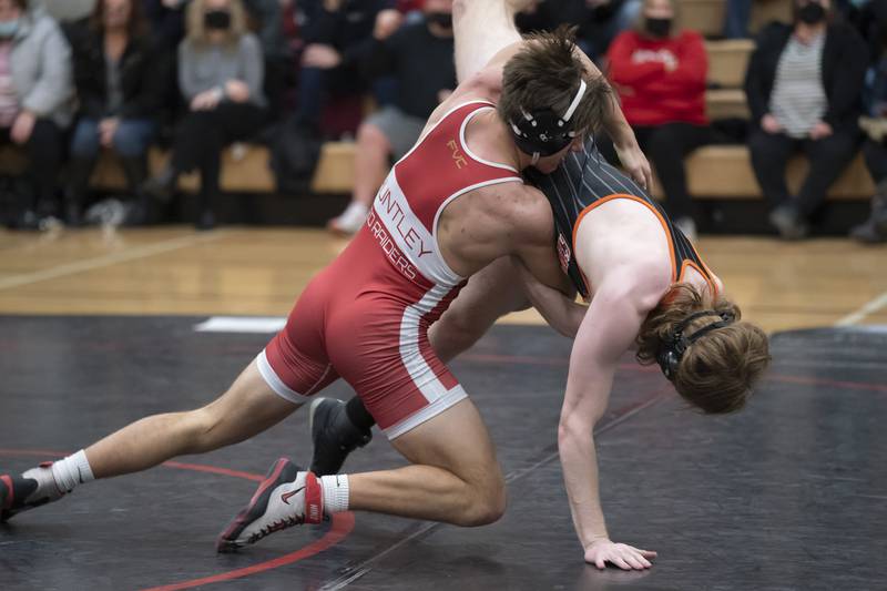 Huntley's Ben Wiley takes down Crystal Lake Central's Thomas Metz during the 195 pound match on Thursday at Huntley High School.