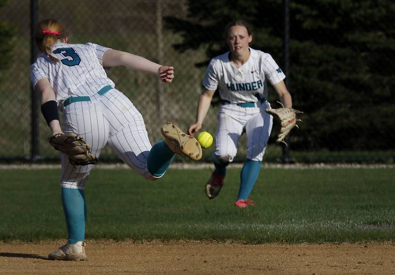 The ball drops between Woodstock North's Aly Jordan and Allyson Schaid during a Kishwaukee River Conference softball game on Thursday, April 16, 2026, at Woodstock North High School.