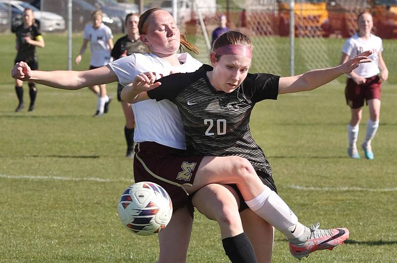 Morris' Makensi Martin (left) and Sycamore's Cortni Kruizenga get tangled up going after a loose ball during their Interstate 8 Conference Tournament semifinal game Wednesday, May 3, 2023, at Sycamore High School.