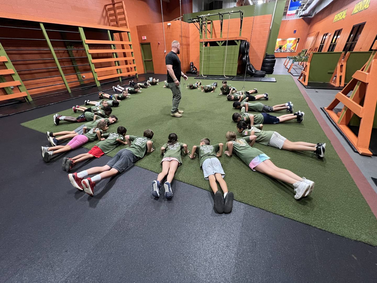 Hot Ground Gym co-owner Doug Gialds instructs children at the gym in Libertyville.