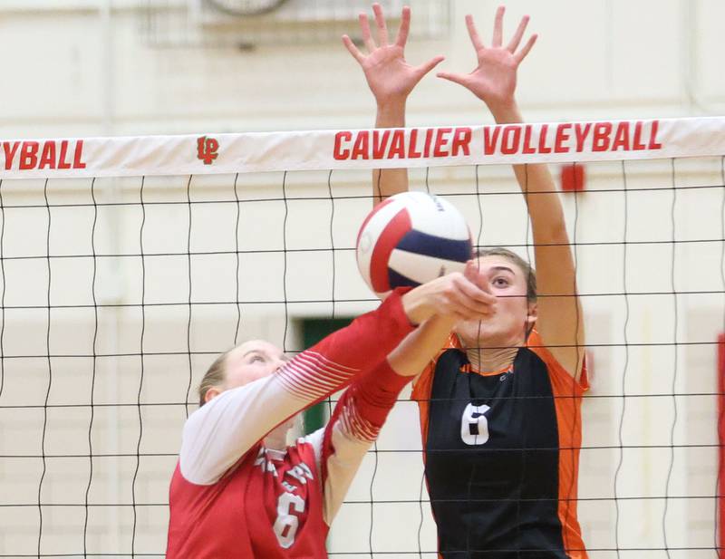 L-P's Maggie Boudreau sends the ball over the net as Washington's Haven Russell looks to make the kill during the Class 3A Sectional final game on Thursday, Nov. 6, 2025 in Sellett Gymasium at L-P High School.