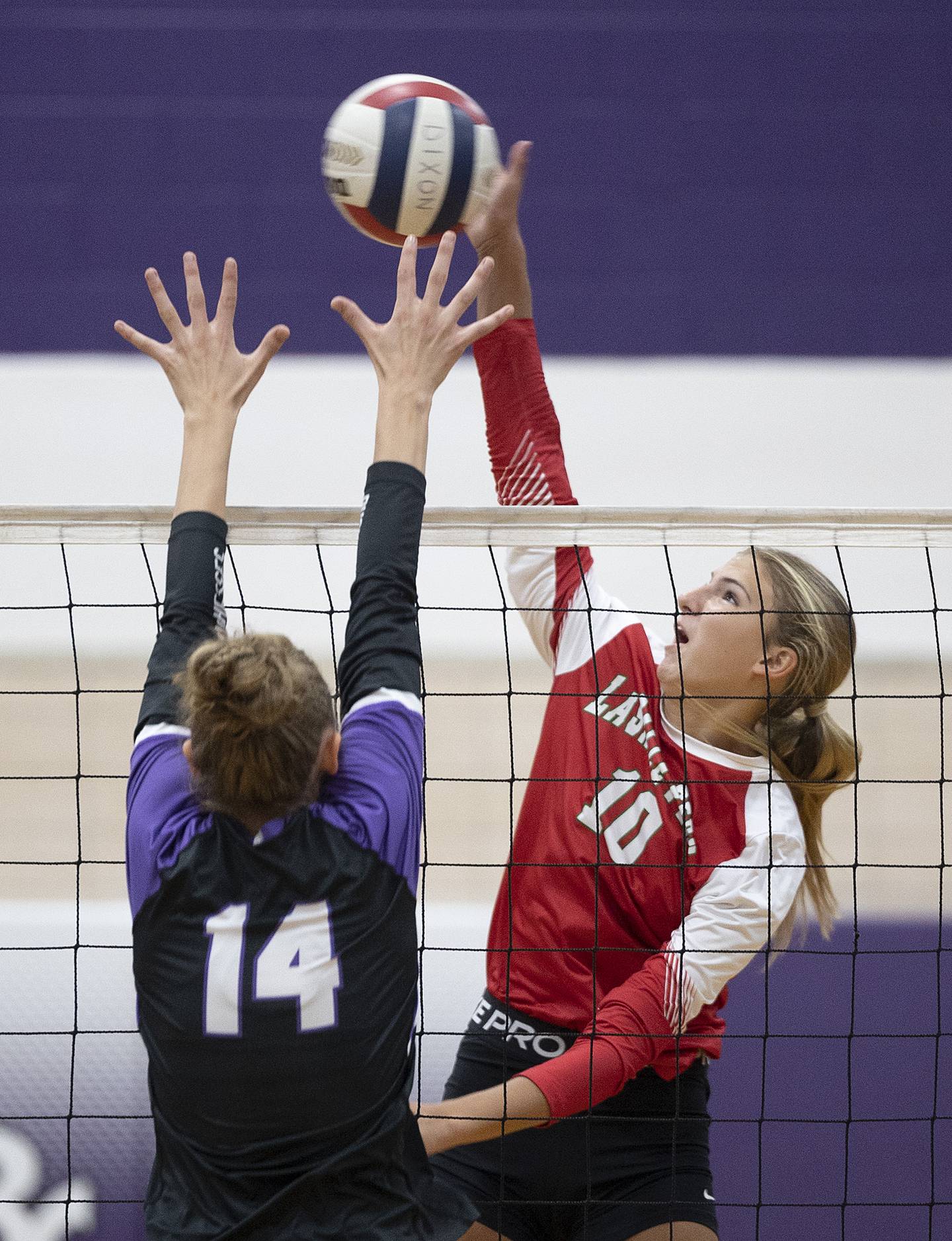 LaSalle-Peru’s Kelsey Frederick plays the ball against Dixon’s Leah Carlson Wednesday, Sept. 10, 2025.