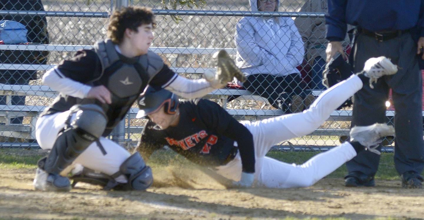 Woodland Catcher Brezdyn Simons is late with the tag at home as Roanoke Benson’s Kody Knecht scores the team’s 10th run in the 4th inning Tuesday at Woodland.