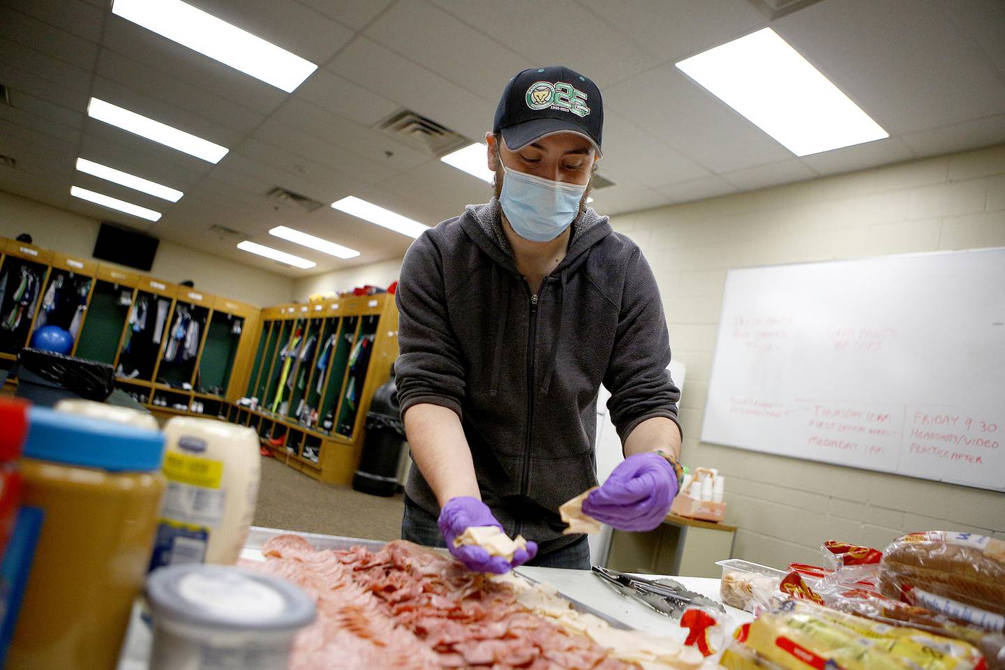 Clubhouse Manager Ryan O'Brien sets out lunch for the players at Northwestern Medicine Field in Geneva. Staff are preparing for the 2021 Kane County Cougars baseball season.