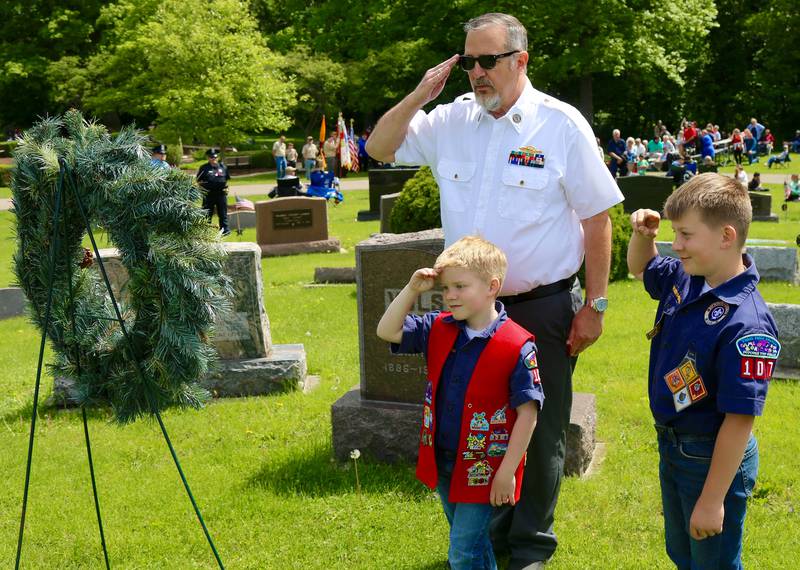 Scouts from Elburn Cub Scout Pack 107 lays a wreath during the Elburn American Legion Annual Memorial Day Observance at the Blackberry Township Cemetery on Monday, May 26, 2025.