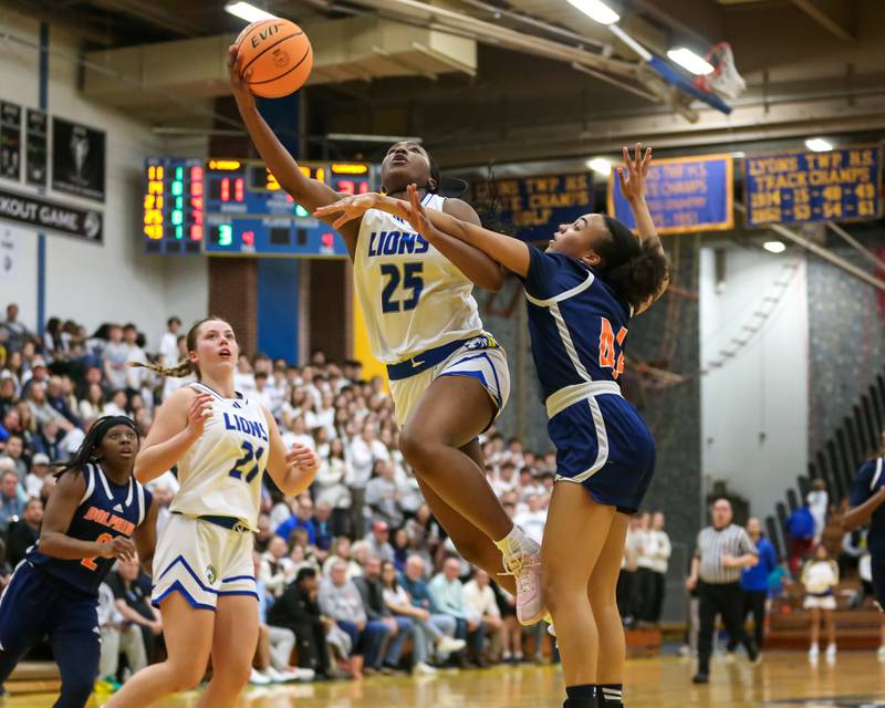 Lyon's Nora Ezike (25) goes in for a layup during their Class 4A Lyons Sectional semifinal basketball game between Lyons vs Young. Feb 25, 2025 in La Grange.