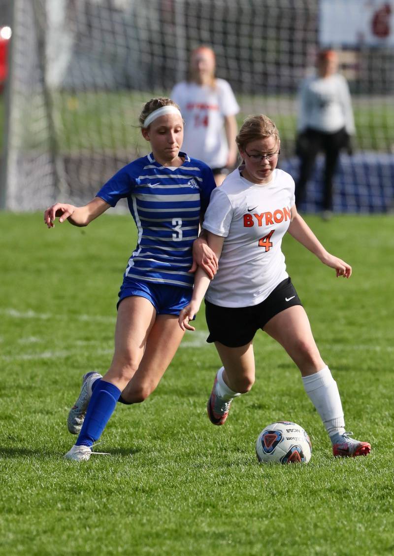 PHS freshmen Chloe Ostrowski battles for the ball against Byron Thursday night at Bryant Field.