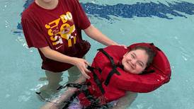 Oswego East parent group donates life vests to help swim class become more inclusive