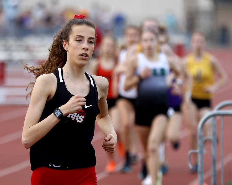Huntley’s Breanna Burak leads the field as she races in the 3,200 meters during the IHSA Class 3A Huntley Girls Track Sectional Wednesday,  May 11, 2022, at Huntley High School.