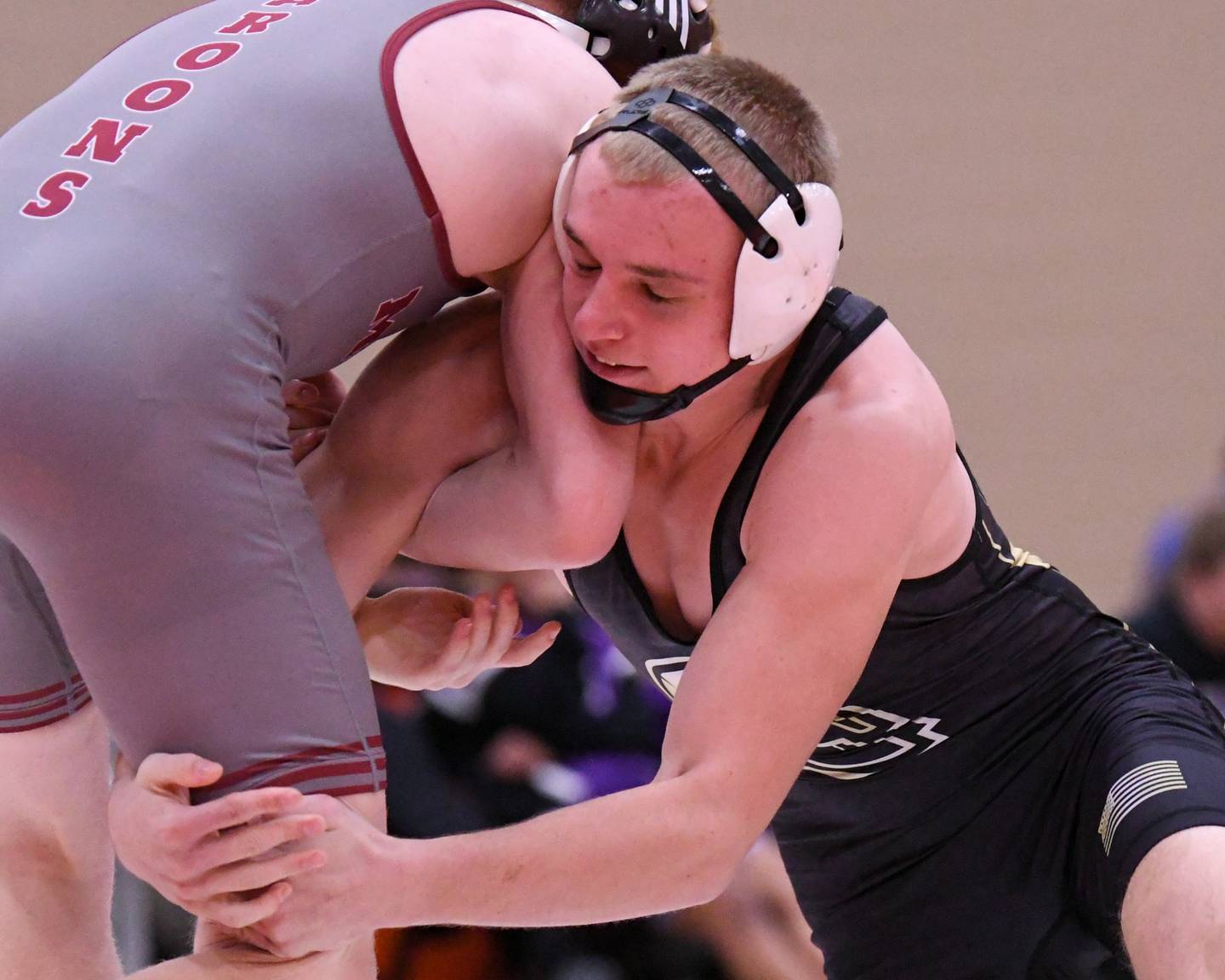 Sycamore’s Cooper Bode, right, keeps a hold of Conor Morel of Moline in the 165-weight class on Tuesday Dec. 30, 2025, during the Flavin Invite held at DeKalb High School.