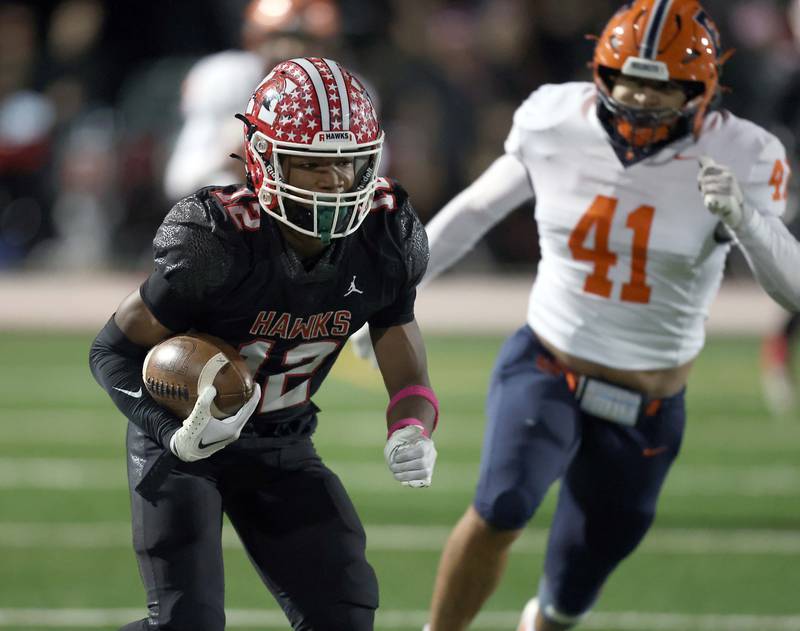 Maine South's Evan Agosto (12) looks to move upfield Friday October 20, 2023 in Park Ridge.