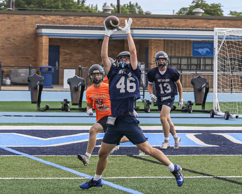 Downers Grove South's Ethan Miller stretches out for a reception during the Downers Grove South 7 on 7 football tournament, July 12, 2025  in Downers Grove.