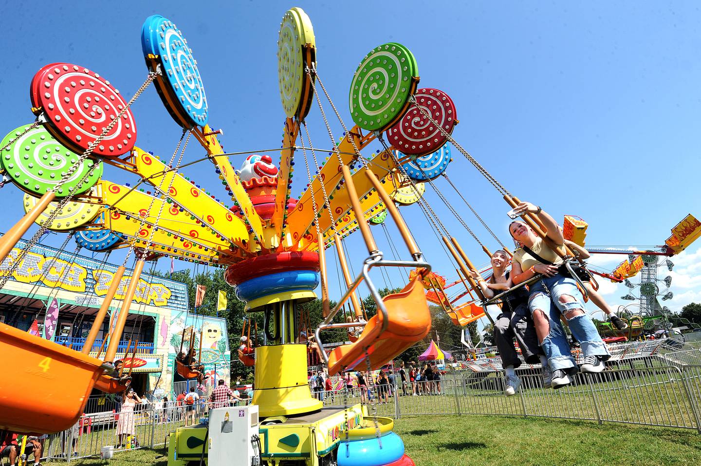 A couple carnival riders take a selfie, while swinging around on an amusement ride at Hometown Days on Sunday, Sept. 1, 2024, at Beecher Park in Yorkville.