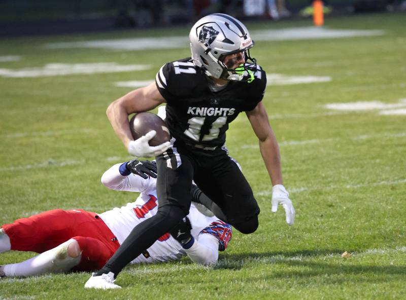 Kaneland's Brady Brown gets by Lakes’ Mason Gialo Saturday, Nov. 1, 2025, during their first round playoff game against Lakes at Kaneland High School in Maple Park.