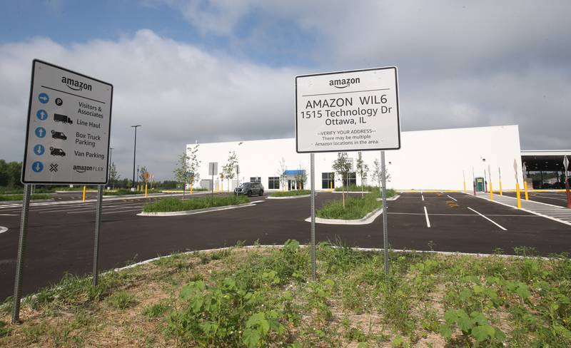 Crews have nearly completed the exterior portion of the Amazon last-mile delivery facility on Wednesday, July 9, 2025, at the Ottawa Industrial Park. Amazon signage is being assembled along with new landscaping. The 50,800-square-foot warehouse will be an addition to Amazon's regional logistics network, helping streamline package delivery to residents and businesses across the region.