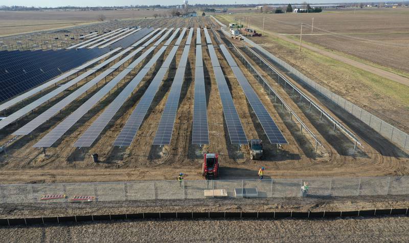 Crews build solar panels for Saliva Solar LLC near the intersection of County Road 1800 North and County Road 2100 East Street on Monday, March 30, 2026 north of Princeton. The solar farm will be a 5-megawatt commercial solar energy facility on 30 acres. When completed, it will provide enough electricity to power 1,100 homes.