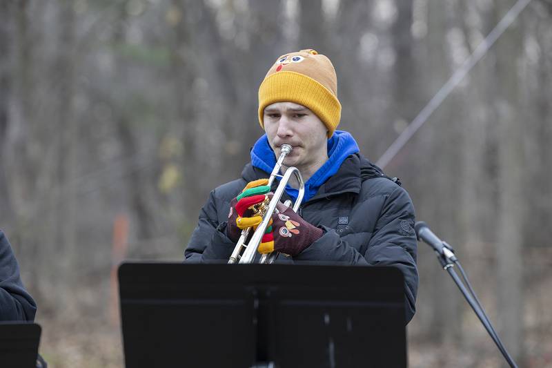 Maxwell DeForest plays the national anthem Thursday, Nov. 28, 2024, at the start of St. Anne’s Turkey Trot 5K. DeForest, who studies music in Boston, brought in friends from the school to play alongside.