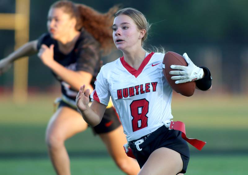Huntley’s Addison Avi runs the ball in varsity flag football at Owen Metcalf Field on the campus of Crystal Lake Central High School in Crystal Lake on Tuesday, Sept. 16, 2025.