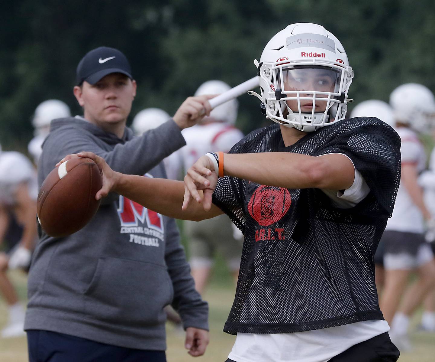 Marian Central’s Cale McThenia throws the football during summer football practice Monday, June 26, 2022, at Marian Central Catholic High School in Woodstock.