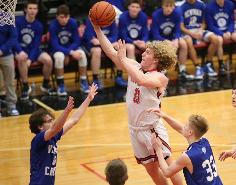 Hall's Mac Resetich drives to the basket as Newman's Nolan Britt and George Jungerman defends on Friday, Feb. 3, 2023 at Hall High School.