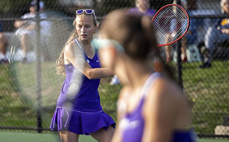 Dixon’s Arielle Tefiku plays a shot with doubles partner Leah Stees in a match against Sterling’s Fareeda Alkhalaf and Sadie Hendrix Thursday, Sept. 28, 2023.