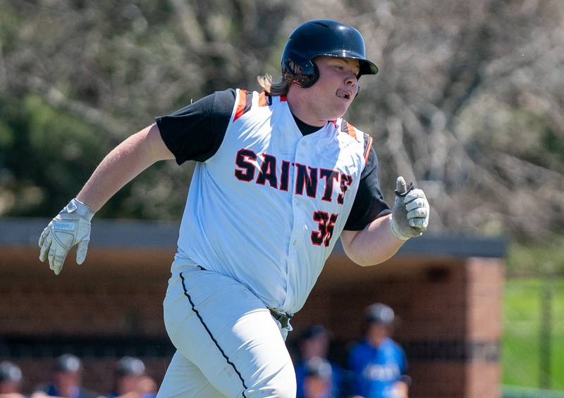 St. Charles East's James Brennan (35) runs to first on a single against St. Charles North during a baseball game at St. Charles East High School on Saturday, May 7, 2022.