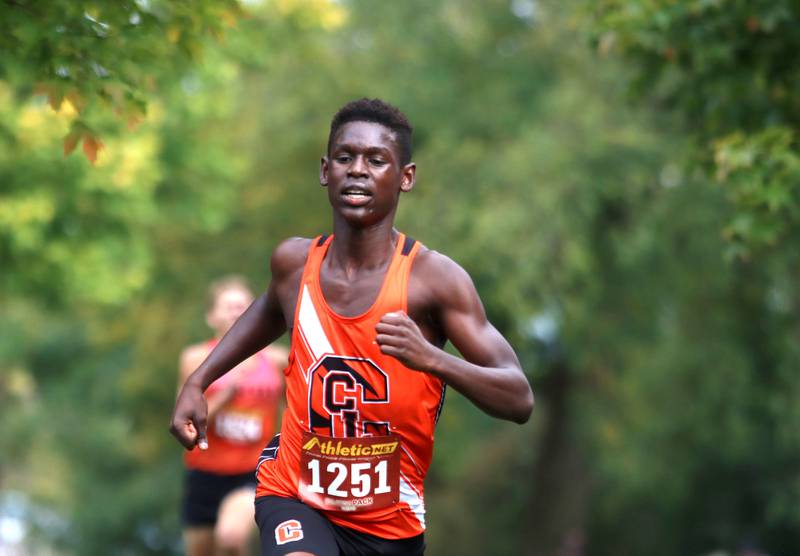 Crystal Lake Central’s Amana Omale wins the Fox Valley Conference Cross Country Meet at McHenry County College in Crystal Lake on Saturday, October. 18, 2025.