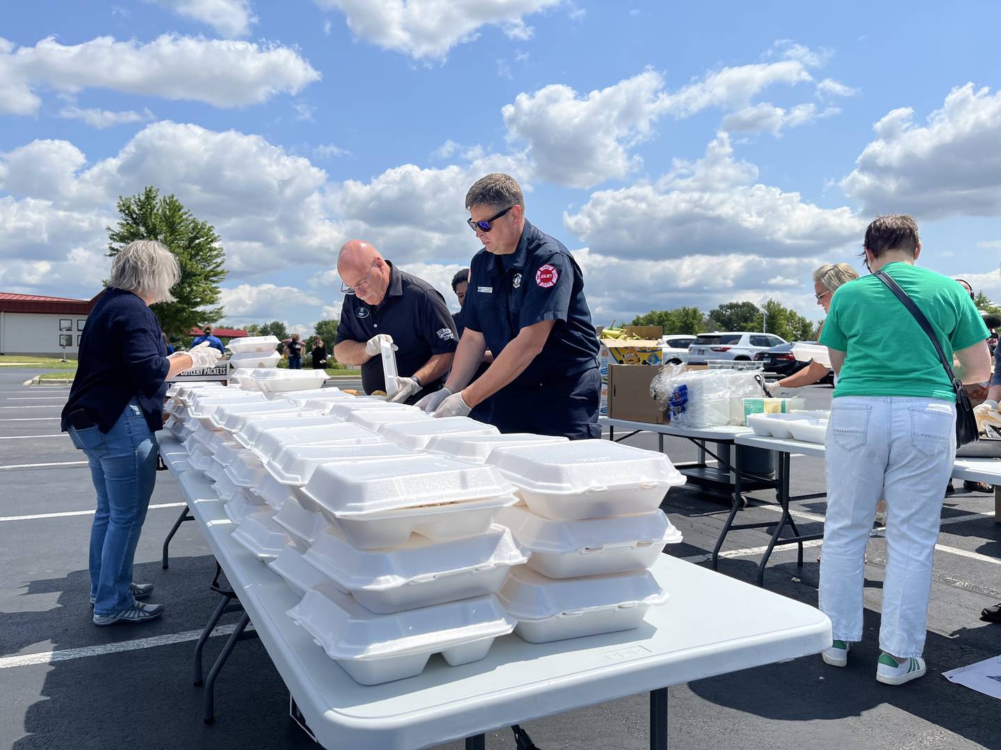 Volunteers at a food distribution event on Thursday, July 18, 2024, at Victory City Church in Joliet. The church partnered with Joliet city officials and American Red Cross to help residents who've been affected by the storms on Monday, July 15, 2024.