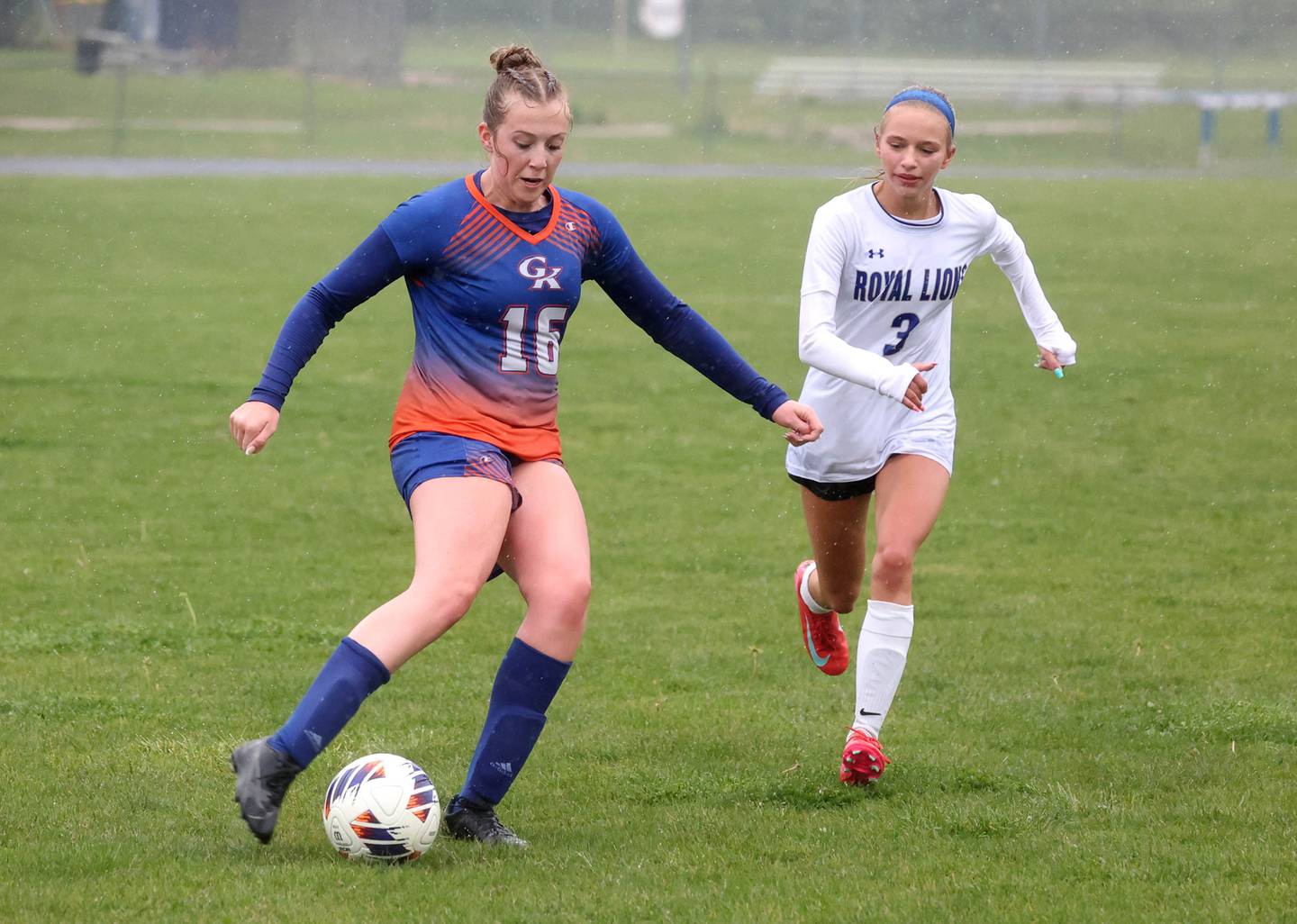 Genoa-Kingston's Ally Poegel scores from distance in front of Rockford Christian's Paige Giardina Tuesday, May 20, 2025, during their Class 2A regional final game at Rockford Christian High School.