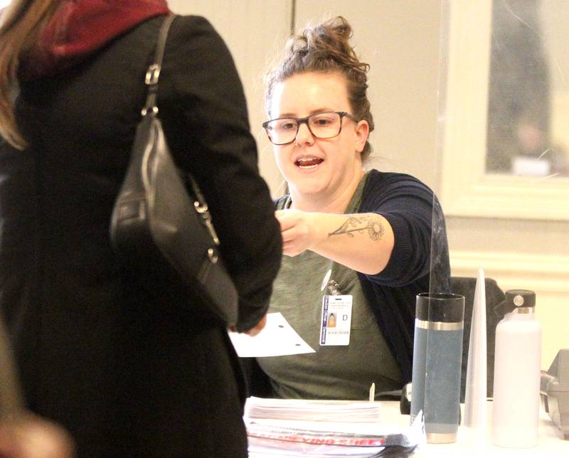 Election Judge Stephanie Varner helps a voter at the Lincoln Inn and Banquets in Batavia for the General Election on Tuesday, Nov. 8, 2022.